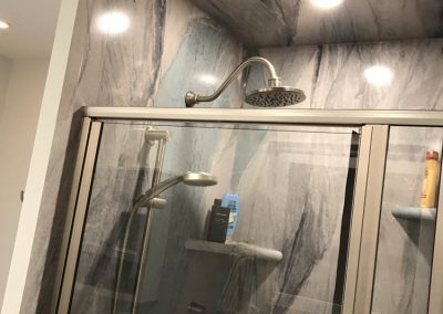 Gray Marble Shower with Silver Showerhead